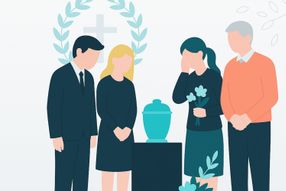 Eine Trauergemeinde an der Urne der verstorbenen Person